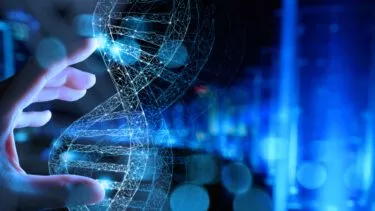En hånd holder over en illustration af DNA