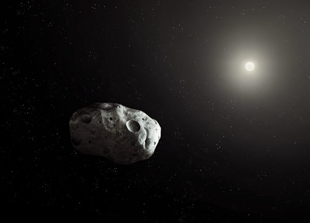 En lille asteroide mod et mørkt verdensrum, delvist oplyst af en fjern stjerrne