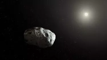 En lille asteroide mod et mørkt verdensrum, delvist oplyst af en fjern stjerrne