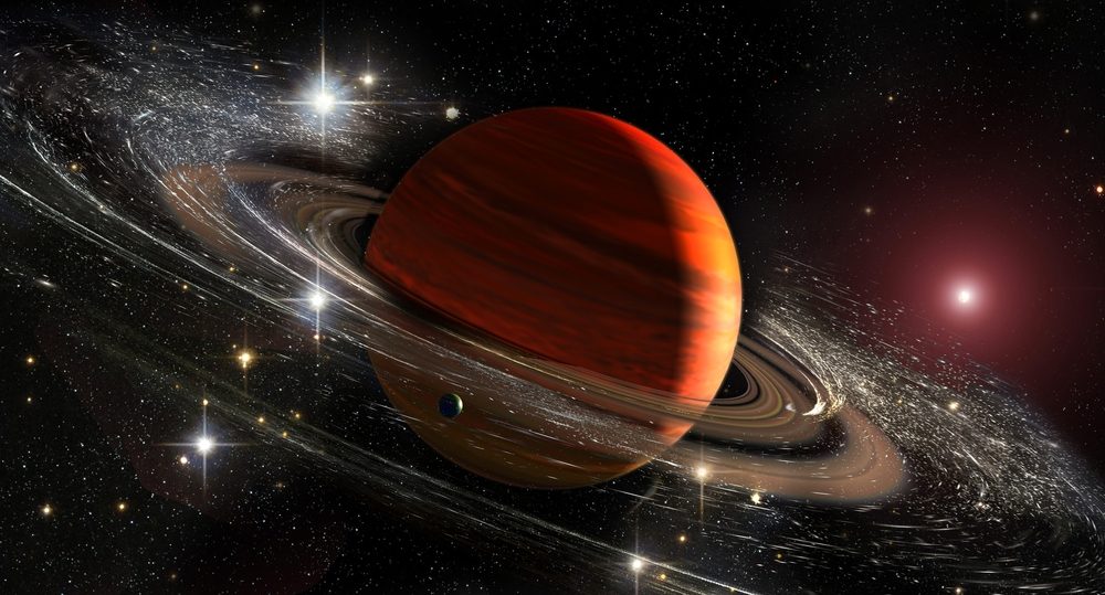 Illustration af Saturn med dens ringe, støv og måner