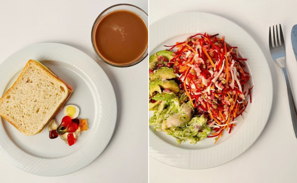 Et top-down-billede af to tallerkener: den ene med skiveskåret brød, forskellige grøntsager og en kop te; den anden med en farverig salat med strimlede grøntsager og avocado, ved siden af en gaffel og kniv på et hvidt bord.