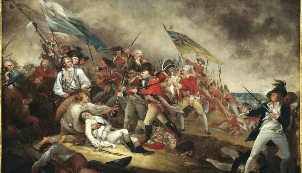 En kaotisk kampscene fra den amerikanske uafhængighedskrig, der viser britiske og amerikanske soldater i kamp, med røg, faldne soldater og vajende flag under en overskyet himmel.